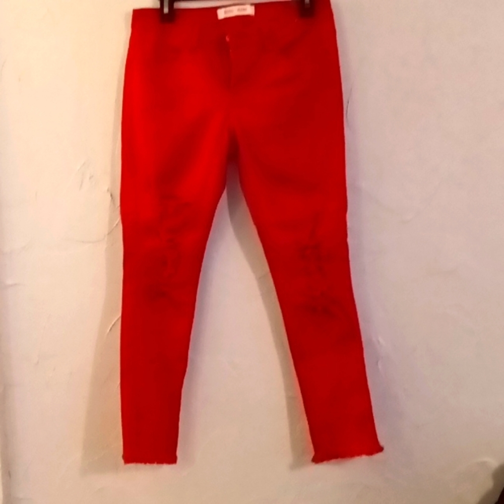 Bright red ripped jeans